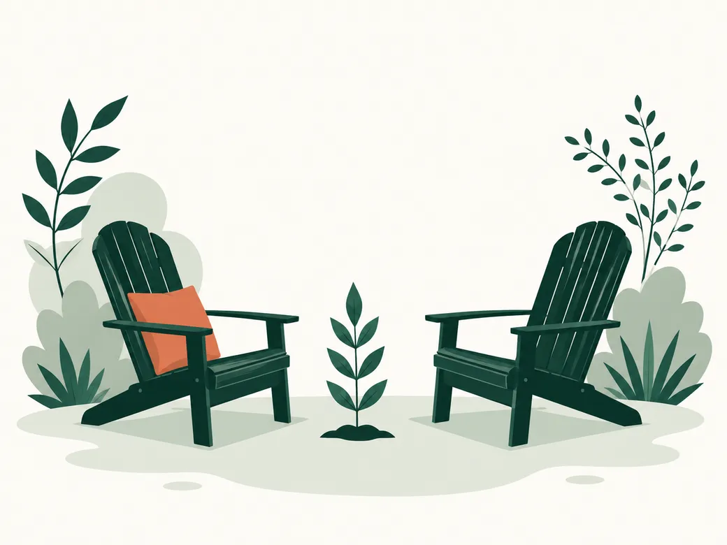 Two garden chairs facing each other beside a young plant
